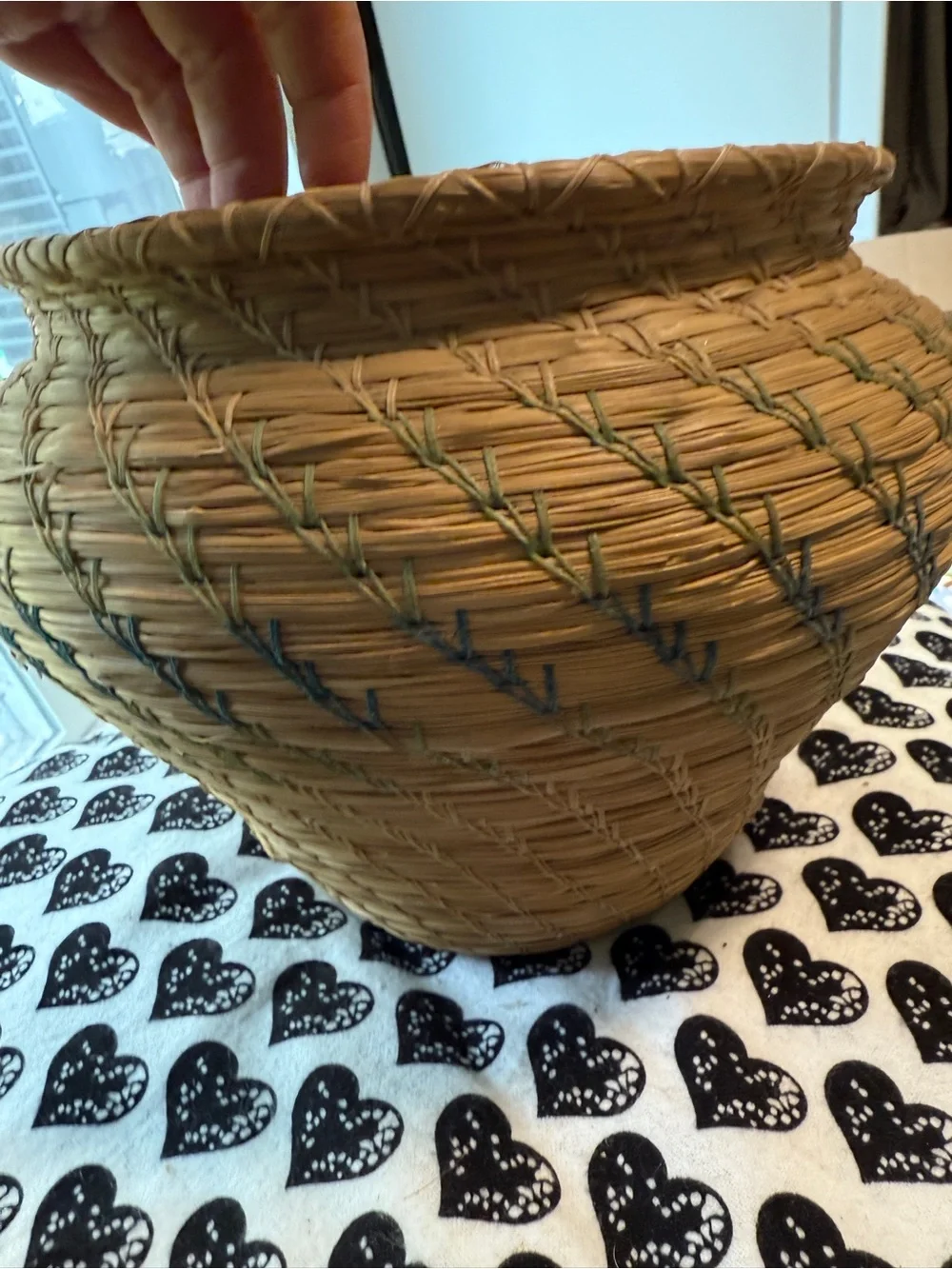 vintage Native American style pine needle basket, similar to those identified